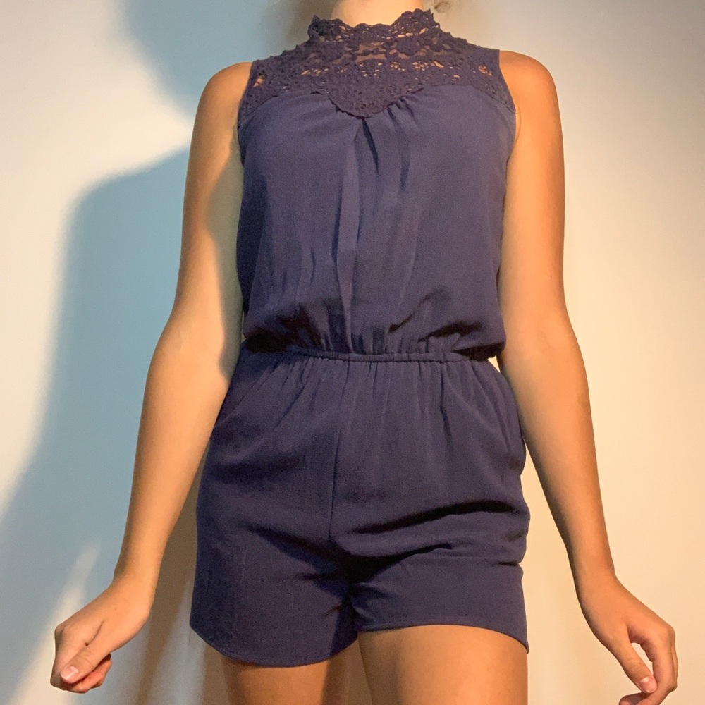 Navy blue tomber with lace halter neck.